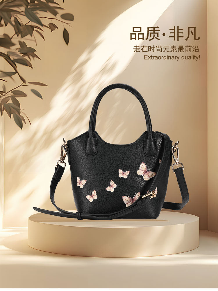 Small black textured bucket bag